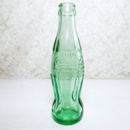 Peoria Illinois 6 oz empty hobbleskirt no refill collectible vintage Christmas Coke bottle. Aqua tinted glass: Front View