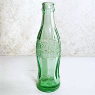 1951 Indiana Evansville vintage empty hobbleskirt PatD Coke bottle with big letters and uneven glass: Front PatD View