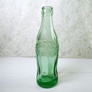 1947 Elizabethtown Kentucky vintage empty hobbleskirt PatD Coke bottle with big letters and uneven glass: patd Side View