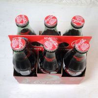 Six 1993 full Seasons Greetings Coca Cola Classic 8 oz soft drink bottles in the original cardboard carton: Top View - Click to enlarge