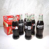 Six 1993 full Seasons Greetings Coca Cola Classic 8 oz soft drink bottles in the original cardboard carton: Bottles Carton View - Click to enlarge