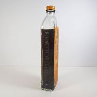 Vintage Dr. Caldwell's constipation relief medicine tonic bottle with paper label and contents: Right Side - Click to enlarge