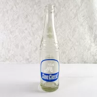 1970 Sun Crest Long Neck 10 oz Vintage ACL Soda Bottle. Blue white graphics. Bands of raised ovals #5: Front - Click to enlarge