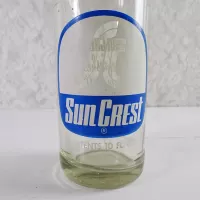 1970 Sun Crest Long Neck 10 oz Vintage ACL Soda Bottle. Blue white graphics. Bands of raised ovals #5: Logo - Click to enlarge