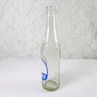 1970 Sun Crest Long Neck 10 oz Vintage ACL Soda Bottle. Blue white graphics. Bands of raised ovals #5: Left - Click to enlarge