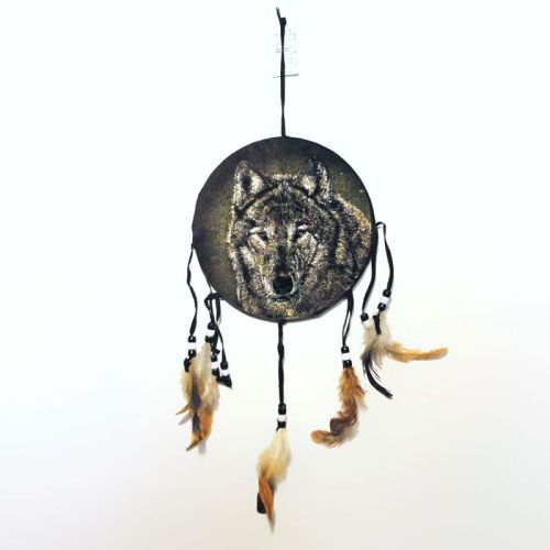 Dream Catcher wolf head on a fabric print with feathers and beads hanging from strips. Dreamcatcher Wall Hanging: Front View