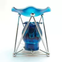Electric oil warmer with melting blue colors on a triangular metal frame. Frostie blue dish. Nightlight: Front - Click to enlarge