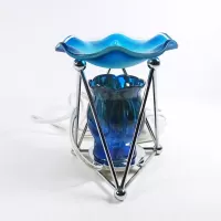 Electric oil warmer with melting blue colors on a triangular metal frame. Frostie blue dish. Nightlight: Right - Click to enlarge