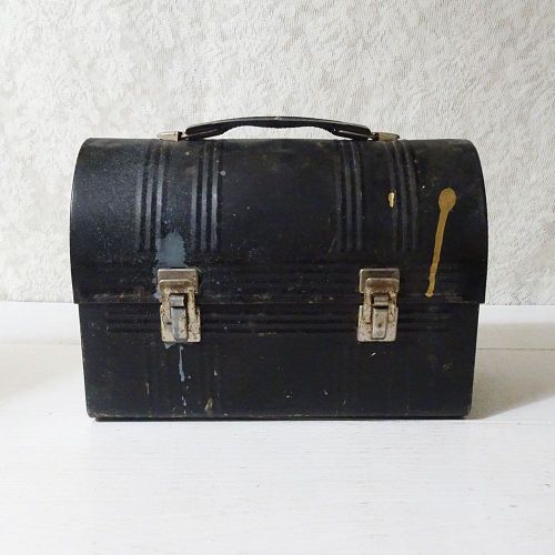 Vintage Aladdin black metal dome top lunch box with small dents and dabs of paint: Front View