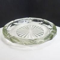 Vintage round clear glass decorative cigar and cigarette ashtray with a starburst design in the center and a criscross X pattern on the side. Main View - Click to enlarge