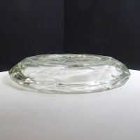 Vintage round clear glass decorative cigar and cigarette ashtray with a starburst design in the center and a criscross X pattern on the side. Bottom Side View - Click to enlarge