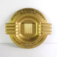 Quality Foods Market round metal salesman sample vintage ashtray with wings. Gold with black graphics: Top View - Click to enlarge