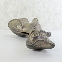 Vintage Siamese cat metal bank with original metal stopper. Wearing a bow tie, one paw is raised in a wavelike pose: Top View - Click to enlarge
