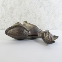 Vintage Siamese cat metal bank with original metal stopper. Wearing a bow tie, one paw is raised in a wavelike pose: Top Side View - Click to enlarge