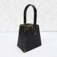 Vintage handmade welded metal cow bell with nut clapper and chipped black paint. Loud ring: Left Side