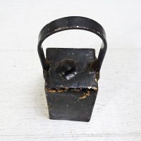 Vintage handmade welded metal cow bell with nut clapper and chipped black paint. Loud ring: Top View - Click to enlarge