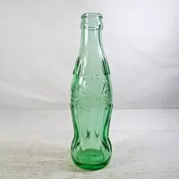 Tampa Florida vintage 6 oz. empty hobbleskirt no refill pat'd Christmas Coke bottle in aqua tinted glass: Pat'd Side - Click to enlarge