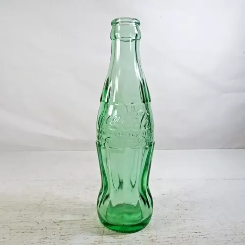 Tampa Florida vintage 6 oz. empty hobbleskirt no refill pat'd Christmas Coke bottle in aqua tinted glass: Pat'd Side