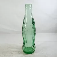 Tampa Florida vintage 6 oz. empty hobbleskirt no refill pat'd Christmas Coke bottle in aqua tinted glass: Content Side - Click to enlarge