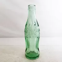 Vintage 1996 Louisville Kentucky 6-1/2 fl. oz. green glass hobbleskirt Coke bottle from Anchor Hocking: Left Side - Click to enlarge