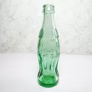 Minneapolis Minnesota 6 oz empty hobbleskirt no refill collectible vintage Christmas Coke bottle. Aqua tinted glass: Front