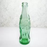Minneapolis Minnesota 6 oz empty hobbleskirt no refill collectible vintage Christmas Coke bottle. Aqua tinted glass: Front - Click to enlarge