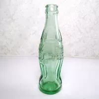 Minneapolis Minnesota 6 oz empty hobbleskirt no refill collectible vintage Christmas Coke bottle. Aqua tinted glass: Right - Click to enlarge