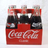Six 1993 full Seasons Greetings Coca Cola Classic 8 oz soft drink bottles in the original cardboard carton: Back View - Click to enlarge