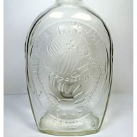 Vintage 1976 Log Cabin cornucopia fall harvest clear glass 24 oz empty bicentennial pancake syrup bottle: Back Closeup View - Click to enlarge