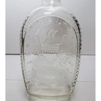 Vintage 1976 Log Cabin American Eagle clear glass 24 oz empty bicentennial pancake syrup bottle: Back Closeup View - Click to enlarge