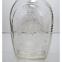Vintage 1976 Log Cabin Musical Marching Soldiers clear glass 24 oz empty bicentennial pancake syrup bottle: Back Closeup View - Click to enlarge