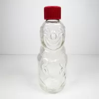 Vintage Bo-Bo the Clown 4 oz. figural glass medicine bottle. Red screw top doubles as the clown's hat: Front - Click to enlarge
