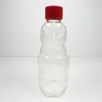 Vintage Bo-Bo the Clown 4 oz. figural glass medicine bottle. Red screw top doubles as the clown's hat: Back - Click to enlarge