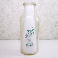 Cloverleaf Dairy in Sandusky, Ohio quart ACL glass milk bottle. Graphics show a baby laying in a crib holding a baby bottle: Back View - Click to enlarge