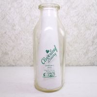 Cloverleaf Dairy in Sandusky, Ohio quart ACL glass milk bottle. Graphics show a baby laying in a crib holding a baby bottle: Back View - Click to enlarge