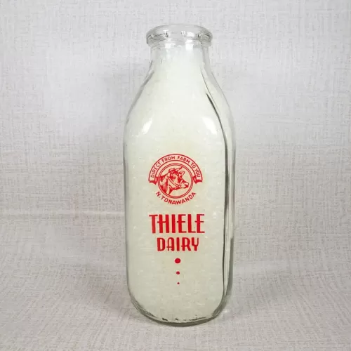 Thiele Dairy vintage clear glass acl one quart milk bottle with red graphics: Front