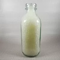 Whole Foods Market Floresville Texas StanPac clear glass square one quart milk bottle with green graphics: Right - Click to enlarge