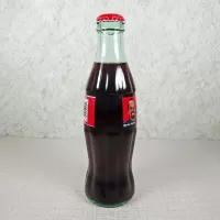 Kyle Petty Nascar No. 44 Coca Cola Racing Family 1999 full 8 oz Coke Classic Bottle: Side - Click to enlarge