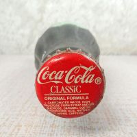 No Location vintage 6-1/2 oz full Coke bottle with white painted graphics and red Coca Cola Classic cap: Top - Click to enlarge