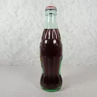Akron Ohio vintage 8 oz full hobbleskirt no refill Coke bottle. Coca Cola Classic cap. Aqua glass: Right - Click to enlarge