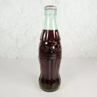 Denver Colorado vintage 8 oz full hobbleskirt no refill Coke bottle with Coca Cola Classic cap: Front - Click to enlarge