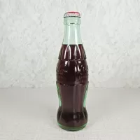 Denver Colorado vintage 8 oz full hobbleskirt no refill Coke bottle with Coca Cola Classic cap: Left - Click to enlarge