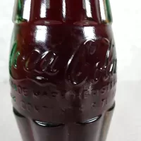 Denver Colorado vintage 8 oz full hobbleskirt no refill Coke bottle with Coca Cola Classic cap: Contents - Click to enlarge
