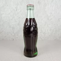 Atlanta Georgia vintage 6 oz full hobbleskirt Coke bottle with red Coca Cola Classic cap: Left - Click to enlarge