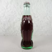 Ottumwa Iowa vintage 8 oz full hobbleskirt no refill Coke bottle with Coca Cola Classic cap: Left - Click to enlarge