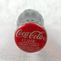 Ottumwa Iowa vintage 8 oz full hobbleskirt no refill Coke bottle with Coca Cola Classic cap: Top - Click to enlarge