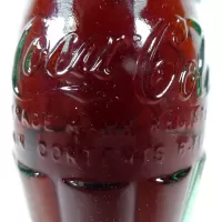 Ottumwa Iowa vintage 8 oz full hobbleskirt no refill Coke bottle with Coca Cola Classic cap: Contents - Click to enlarge