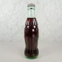 Louisville Kentucky vintage 8 oz full hobbleskirt no refill Coke bottle with Coca Cola Classic cap: Left - Click to enlarge