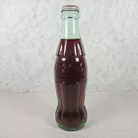 New Orleans Louisiana vintage 8 oz full hobbleskirt no refill Coke bottle with Coca Cola Classic cap: Front - Click to enlarge