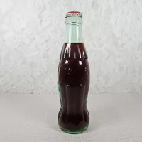 New Orleans Louisiana vintage 8 oz full hobbleskirt no refill Coke bottle with Coca Cola Classic cap: Back - Click to enlarge